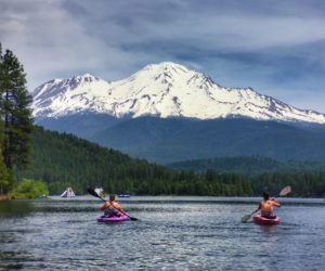 A couple kayaking on Lake Siskiyou with view of Mt. Shasta